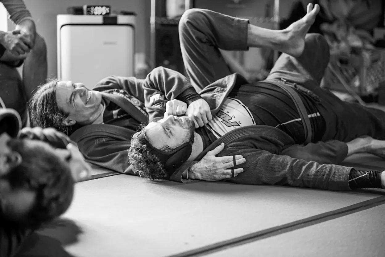 Two practitioners demonstrating Brazilian Jiu-Jitsu in gis